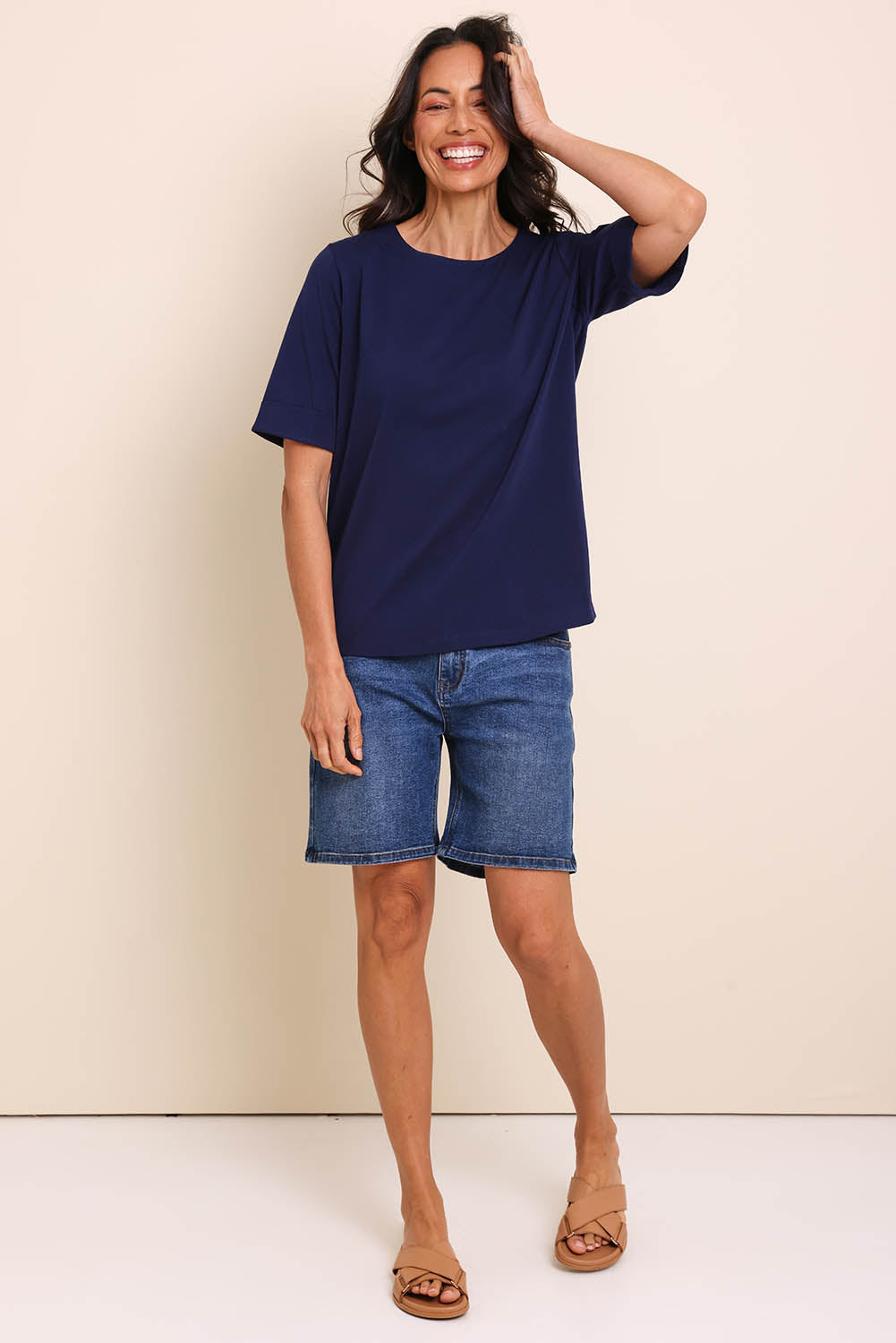 Model Amandam wearing size 10 of the The Keepers Relaxed Fit Tee – Navy in colour Navy, from the front
