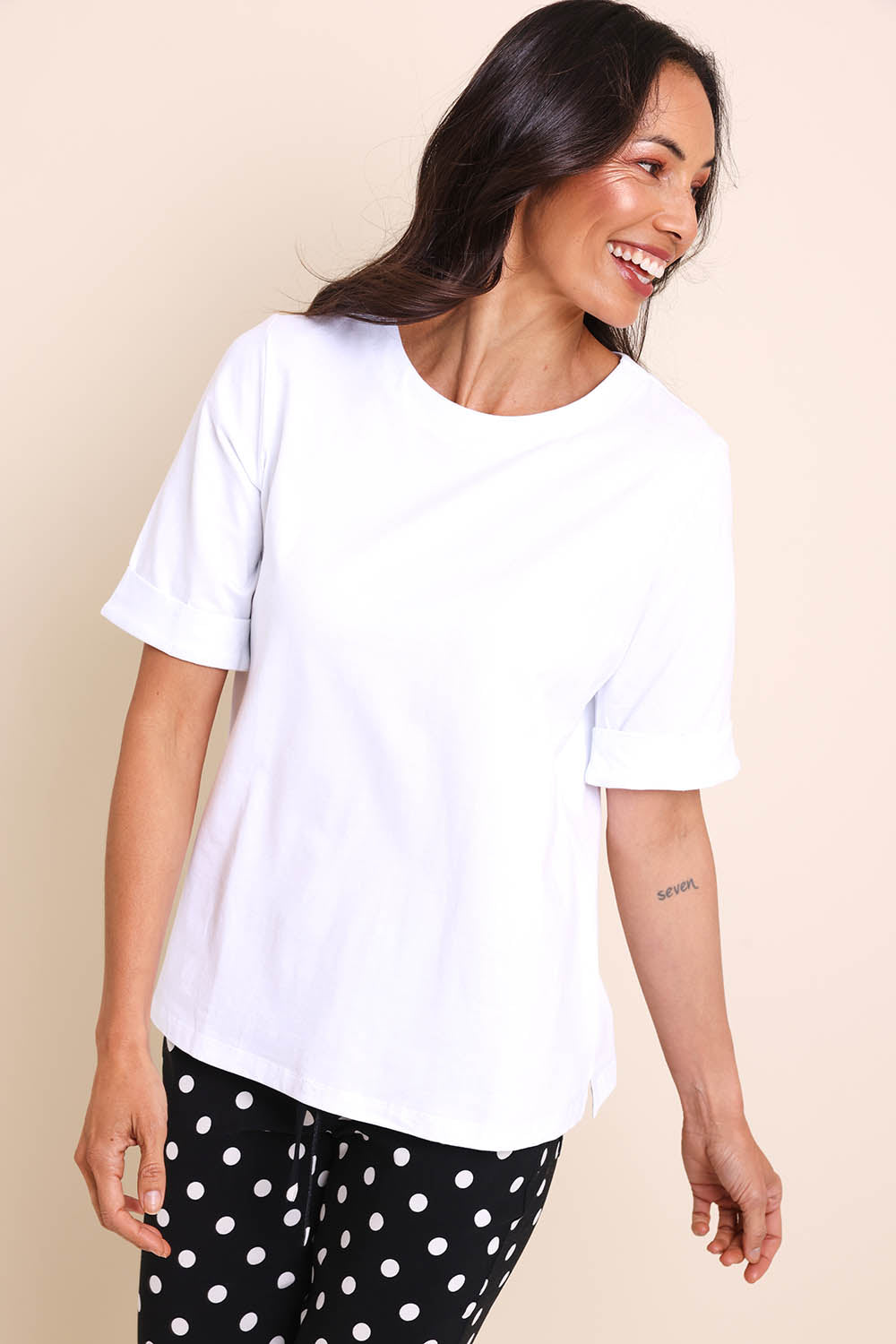 Model Amandam wearing size 10 of the The Keepers Relaxed Fit Tee – White in colour White, from an angle