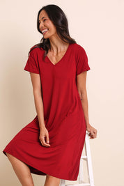 Model Amandam wearing size 10 of the The Easy Wear Bamboo Tee Dress – Cherryred in colour Cherryred, from an angle