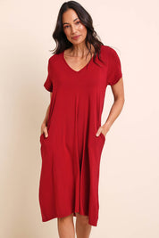 Model Amandam wearing size 10 of the The Easy Wear Bamboo Tee Dress – Cherryred in colour Cherryred, in a cropped view