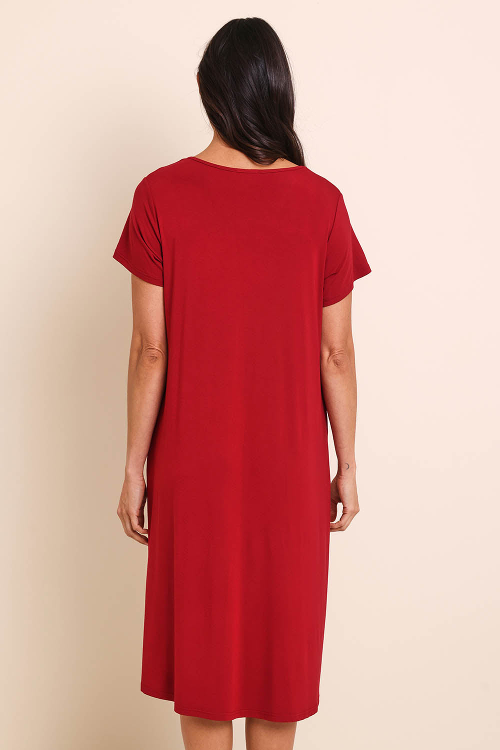 Model Amandam wearing size 10 of the The Easy Wear Bamboo Tee Dress – Cherryred in colour Cherryred, from the front