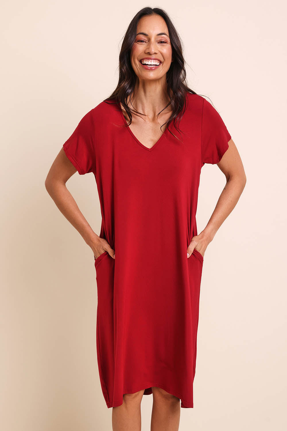 Model Amandam wearing size 10 of the The Easy Wear Bamboo Tee Dress – Cherryred in colour Cherryred, from the front