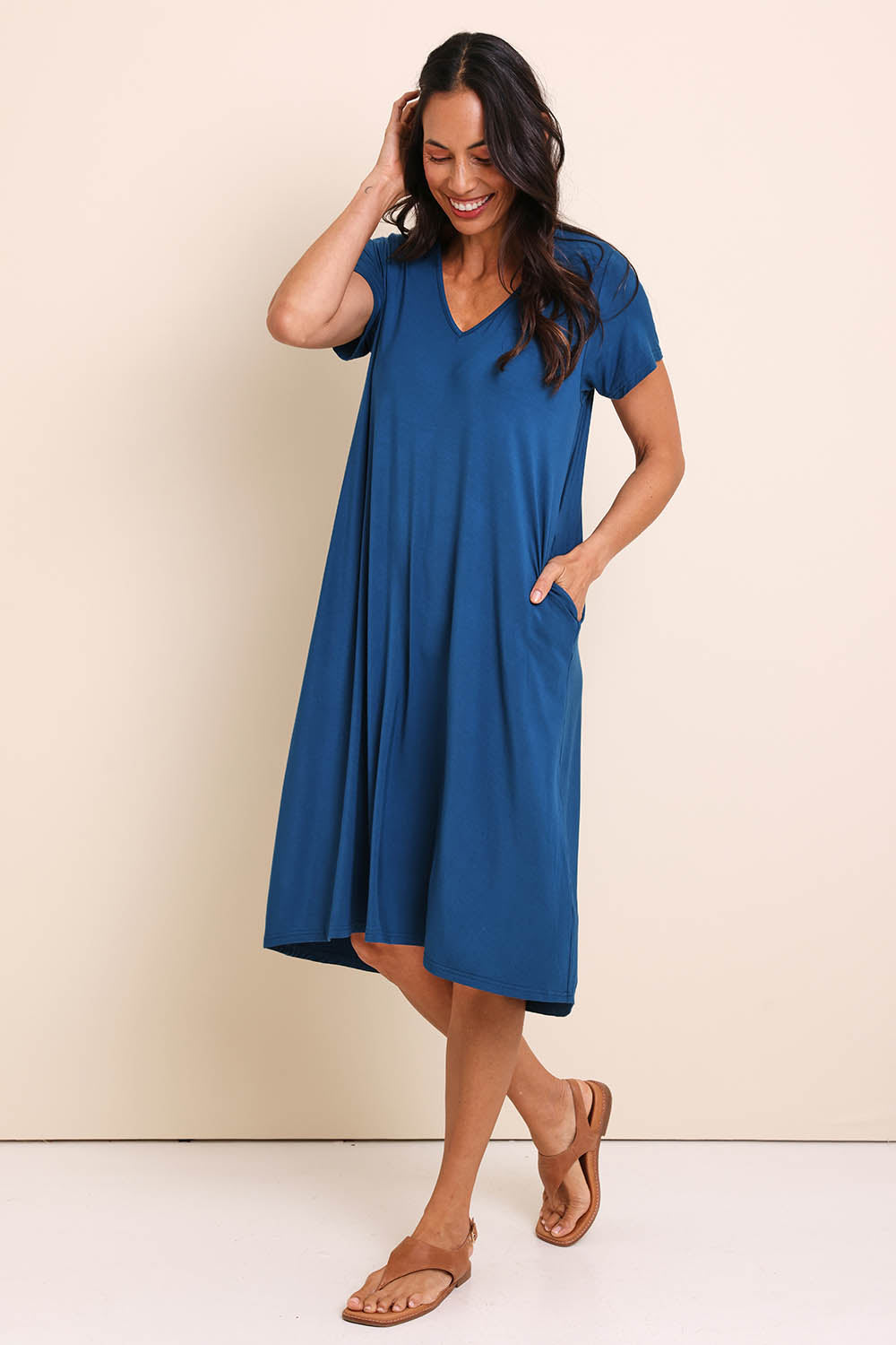Model Amandam wearing size 10 of the The Easy Wear Bamboo Tee Dress – Marine in colour Marine, from the front