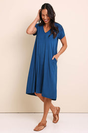 Model Amandam wearing size 10 of the The Easy Wear Bamboo Tee Dress – Marine in colour Marine, from the front