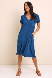 Model Amandam wearing size 10 of the The Easy Wear Bamboo Tee Dress – Marine in colour Marine, from the front