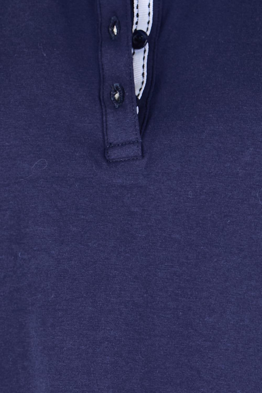Product shot of the The Keepers Polo Tee – Navy in colour Navy, showing detail