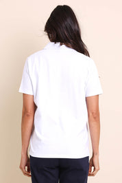 Model Amandam wearing size 10 of the The Keepers Polo Tee – White in colour White, from the back