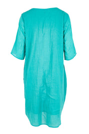 Product shot of the The Summer Cotton Shift Dress With Pockets – Lagoon in colour Lagoon, from the back