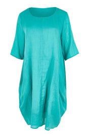 Product shot of the The Summer Cotton Shift Dress With Pockets – Lagoon in colour Lagoon, from the front