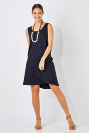 Model Anna wearing size 10 of The Sleeveless Swing Dress in colour WashBlack (Black), from the front, showing the whole outfit