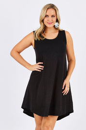Model Jess wearing size 12 of The Sleeveless Swing Dress in colour WashBlack (Black), from the front, cropped image