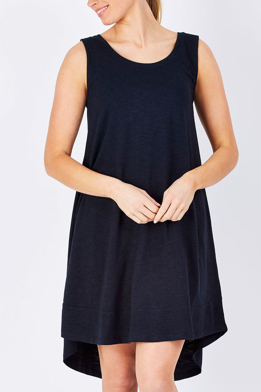 Model Maddy wearing size 10 of The Sleeveless Swing Dress in colour WashBlack (Black), from the front, cropped image