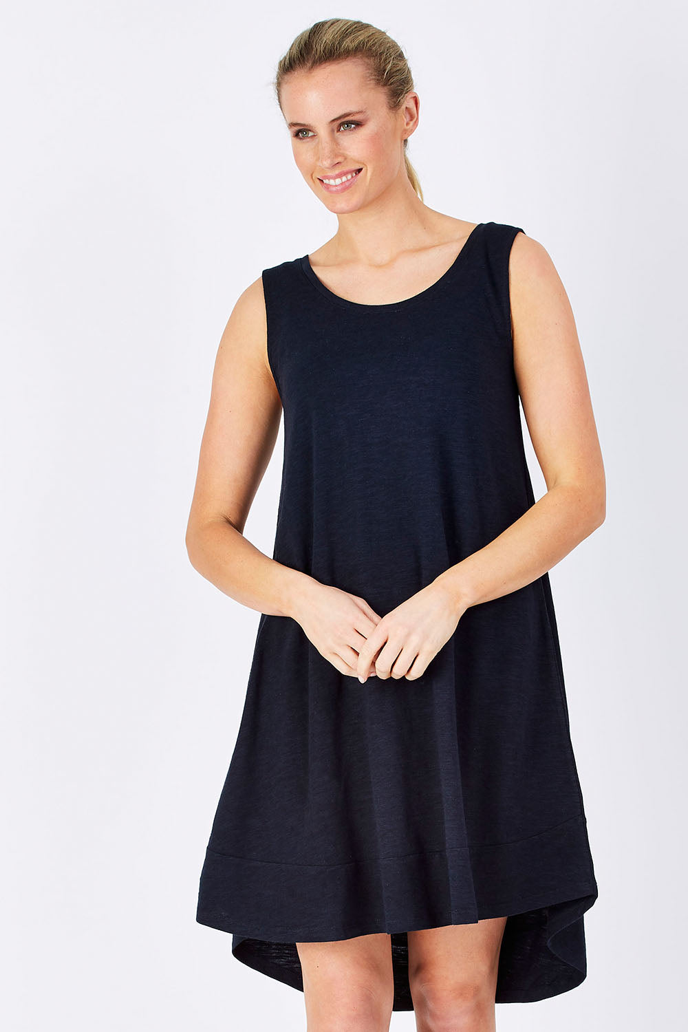 Model Maddy wearing size 10 of The Sleeveless Swing Dress in colour WashBlack (Black), from the front, cropped image