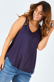 Model Laura wearing size 12 of The Bamboo Tank in colour DarkNavy (Blue), from the front, cropped image