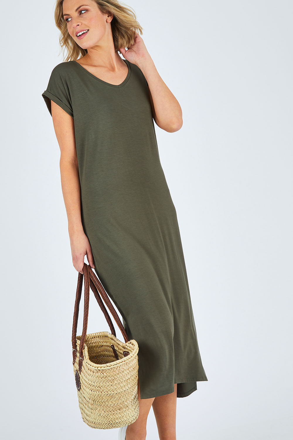 Model Chelsea wearing size 10 of The Mid Length Tee Dress in colour Khaki (Green), from the front, showing the whole outfit