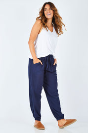 Model Laura wearing size 14 of The Soft Utility Pant in colour Navy (Blue), from the front, showing the whole outfit
