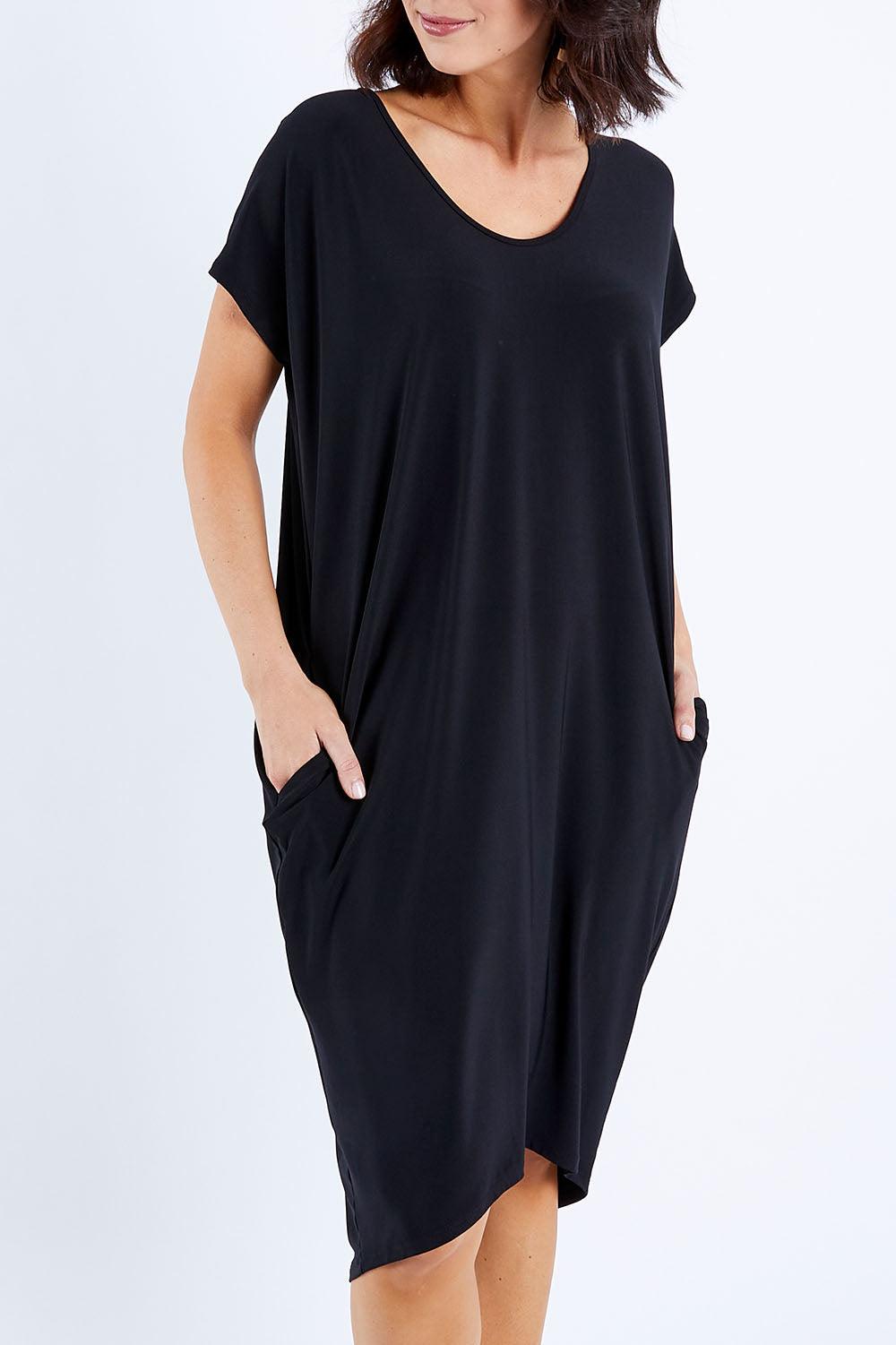 Model Andrea wearing size 22 of The Drape Jersey Dress in colour Black (Black), from the front, cropped image