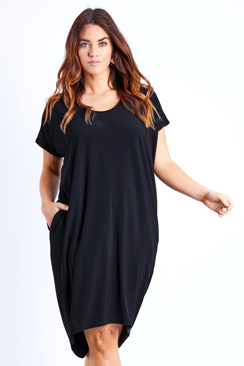 Model Laura wearing size 14 of The Drape Jersey Dress in colour Black (Black), from the front, cropped image