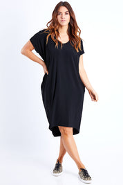 Model Laura wearing size 14 of The Drape Jersey Dress in colour Black (Black), from the front, showing the whole outfit