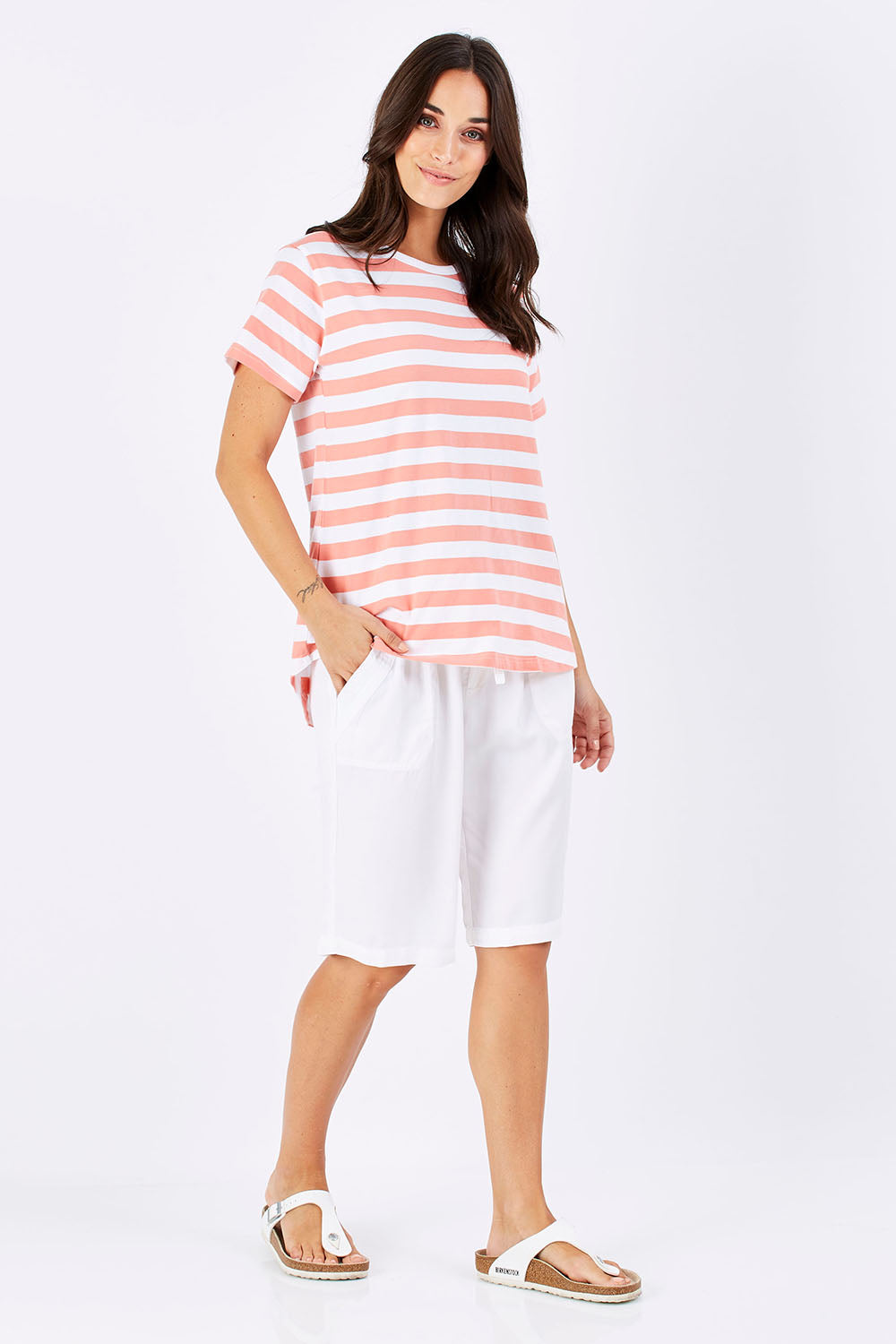 Model Georgia wearing size 10 of The Stripe Tee in colour PeachStrip (Pink), from the front, showing the whole outfit