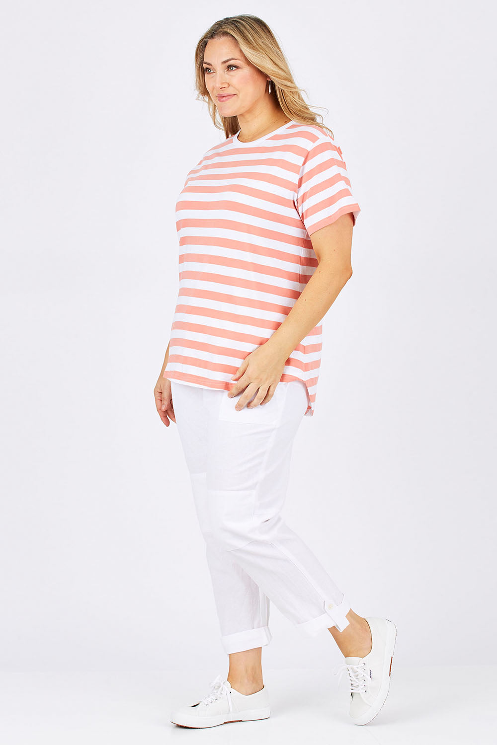 Model Ljubenka wearing size 18 of The Stripe Tee in colour PeachStrip (Pink), from the front, showing the whole outfit
