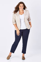 Model Mae wearing size 18 of The Soft Ankle Grazer Pant in colour Navy (Blue), from the front, showing the whole outfit