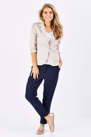 Model Marnee wearing size 10 of The Soft Ankle Grazer Pant in colour Navy (Blue), from the front, showing the whole outfit
