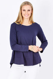 Model Maddy wearing size 8 of The Long Sleeve Swing Tee in colour DenimBlue (Blue), from the front, cropped image