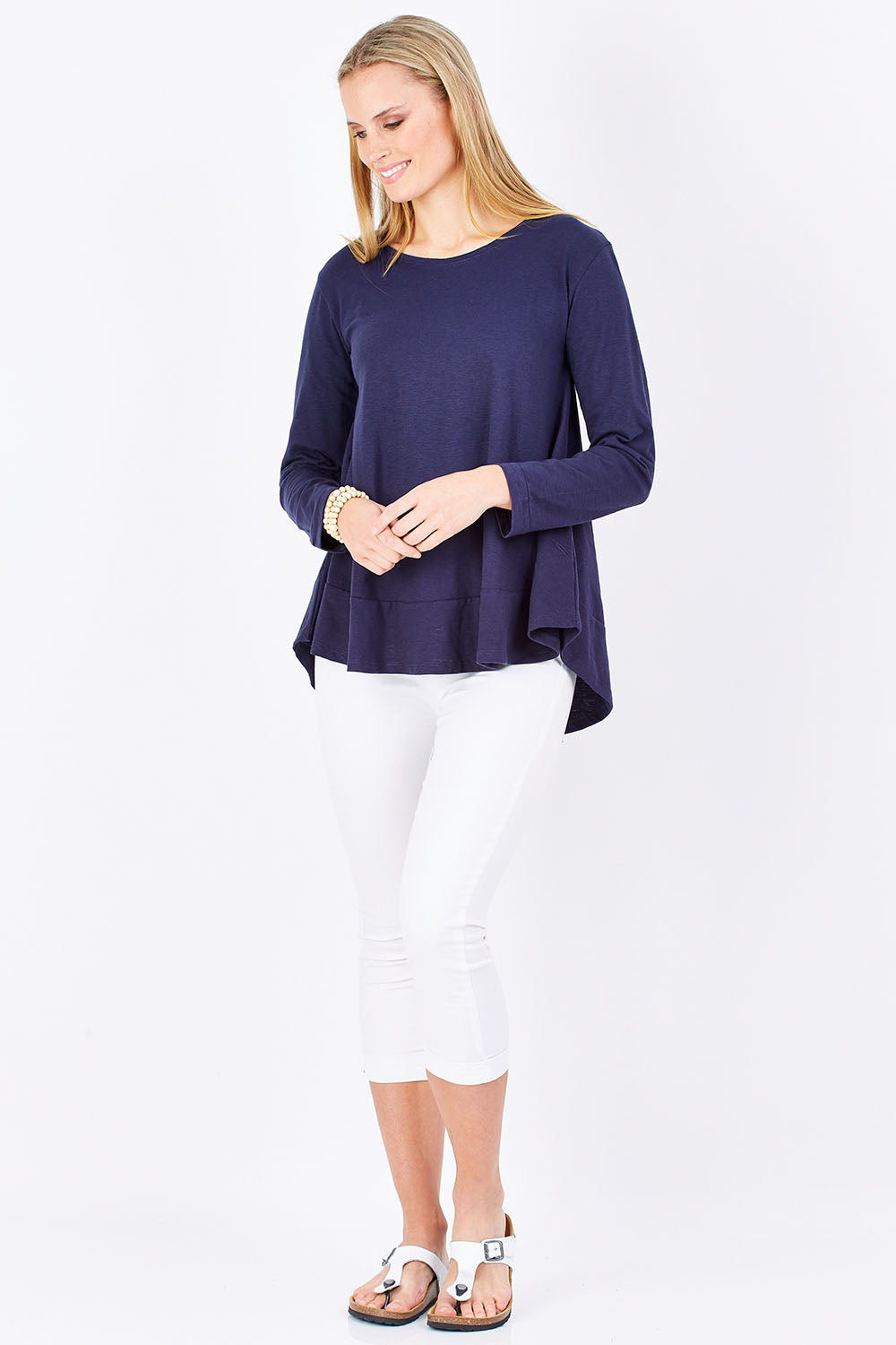 Model Maddy wearing size 8 of The Long Sleeve Swing Tee in colour DenimBlue (Blue), from the front, showing the whole outfit