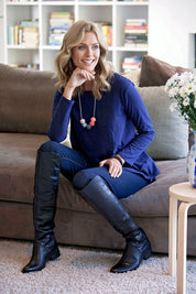 Model Natalie wearing size 8 of The Long Sleeve Swing Tee in colour DenimBlue (Blue), from the front, showing the whole outfit