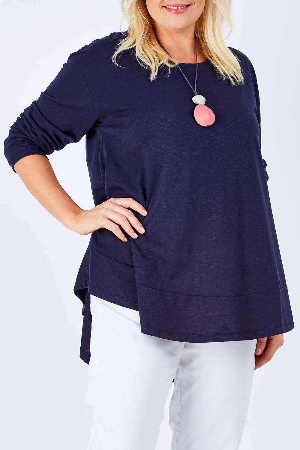 Model Natalie wearing size 16 of The Long Sleeve Swing Tee in colour DenimBlue (Blue), from the front, cropped image