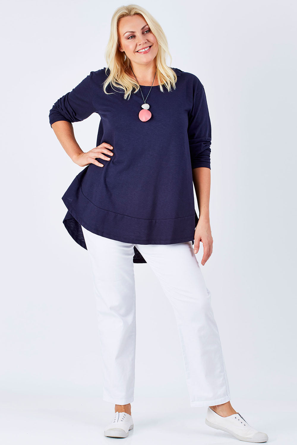 Model Natalie wearing size 16 of The Long Sleeve Swing Tee in colour DenimBlue (Blue), from the front, showing the whole outfit