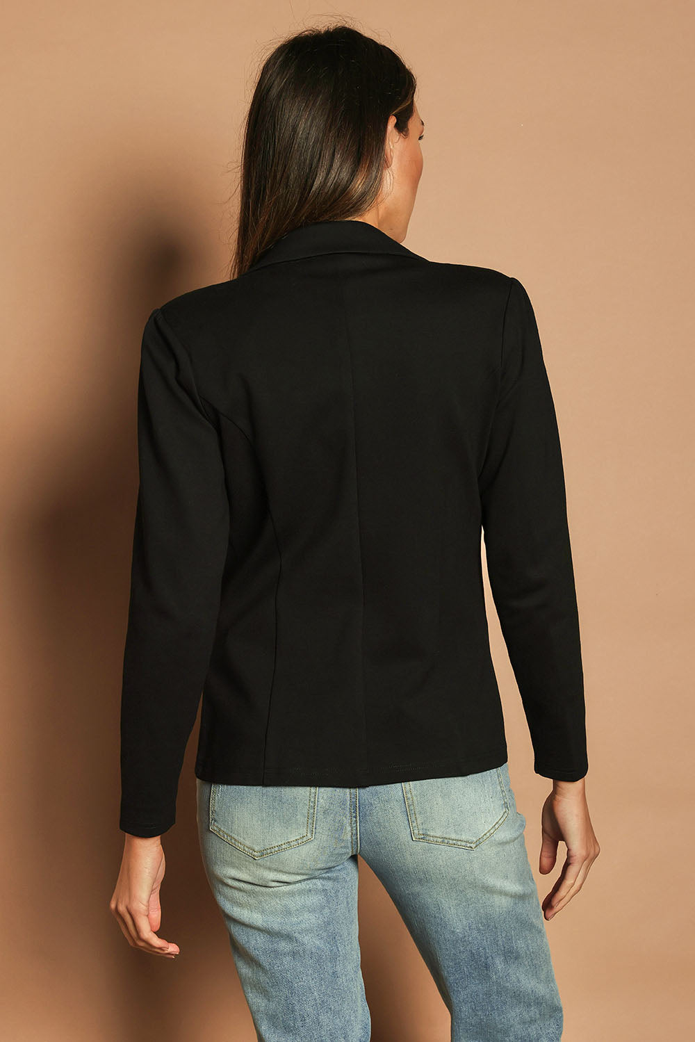 Model Madeline wearing size 10 of The Ponte Blazer in colour Black (Black), from the back