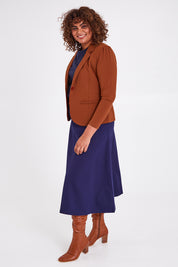 Model Anucia wearing size 14 of The Ponte Blazer in colour Ochre, from the front, showing the whole outfit
