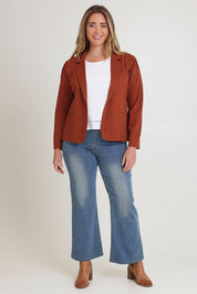 Model Chanel wearing size 16 of The Ponte Blazer in colour Ochre, from the front, showing the whole outfit