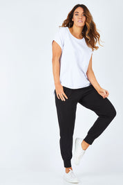 Model Laura wearing size 14 of The Basic Keeper Pant in colour Black (Black), from the front, showing the whole outfit
