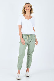 Model Chelsea wearing size 10 of The Weekender Pant in colour Khaki (Green), from the front, showing the whole outfit