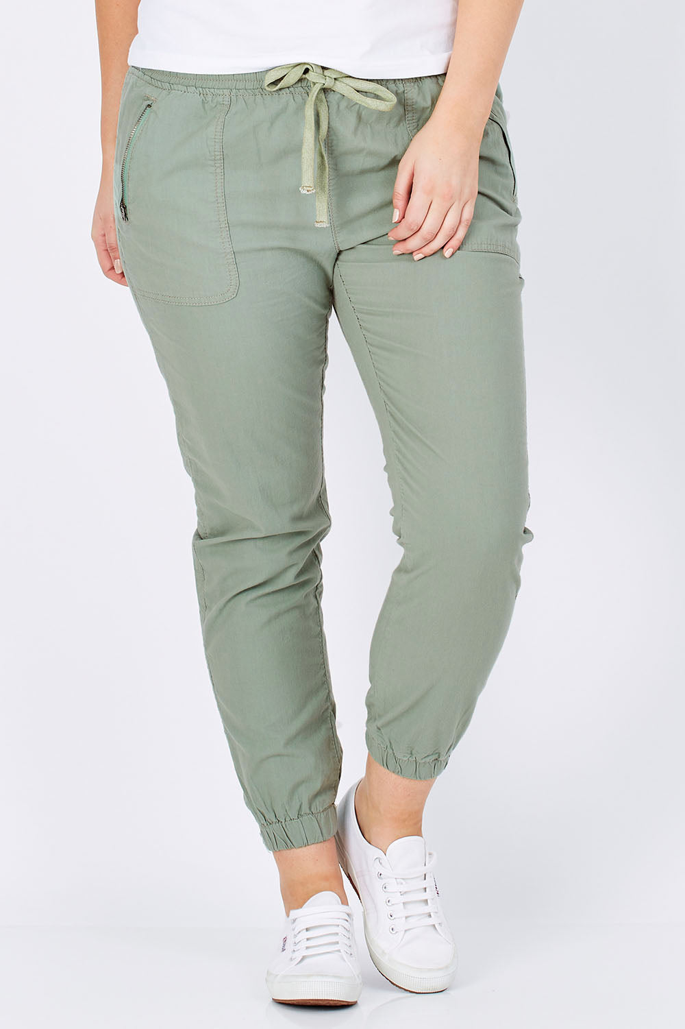 Model Jess wearing size 12 of The Weekender Pant in colour Khaki (Green), from the front, cropped image
