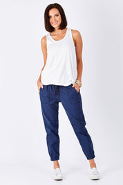 Model Perrie wearing size 10 of The Weekender Pant in colour Navy (Blue), from the front, showing the whole outfit