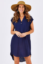Model Clementine wearing size 10 of The Bonded Cotton Dress in colour FrenchNavy (Blue), from the front, cropped image