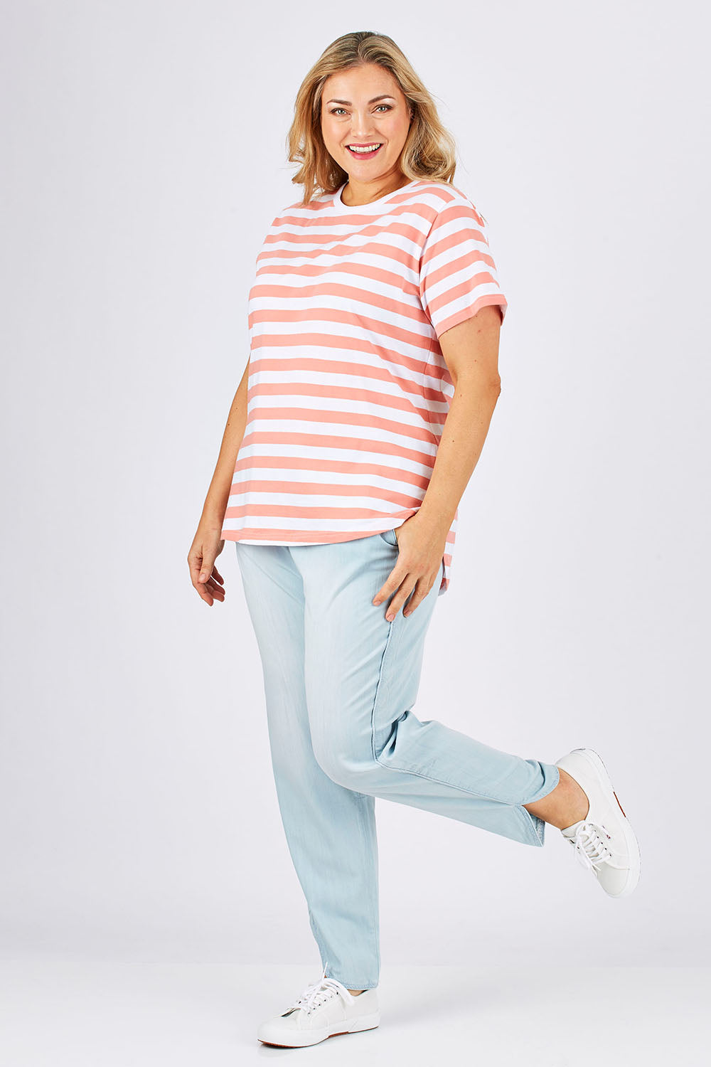 Model Ljubenka wearing size 18 of The Chambray Curved Hem Pant in colour Chambray (Blue), from the front, showing the whole outfit