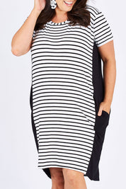 Model Mae wearing size 18 of The Contrast Panel Dress in colour Blkstripe (Black), from the front, cropped image