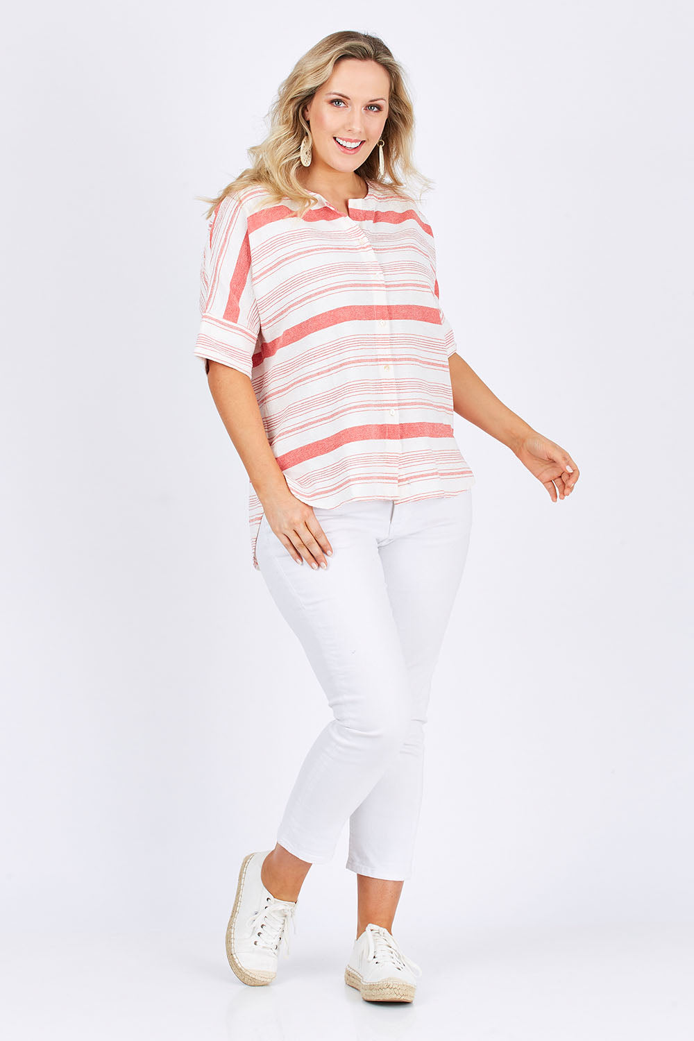 Model Jess wearing size 14 of The Stripe Button Through Top in colour Coral (Pink), from the front, showing the whole outfit
