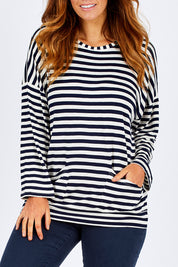 Model Laura wearing size 12 of The Slouch Pocket Tee in colour Stripe (Blue), from the front, cropped image
