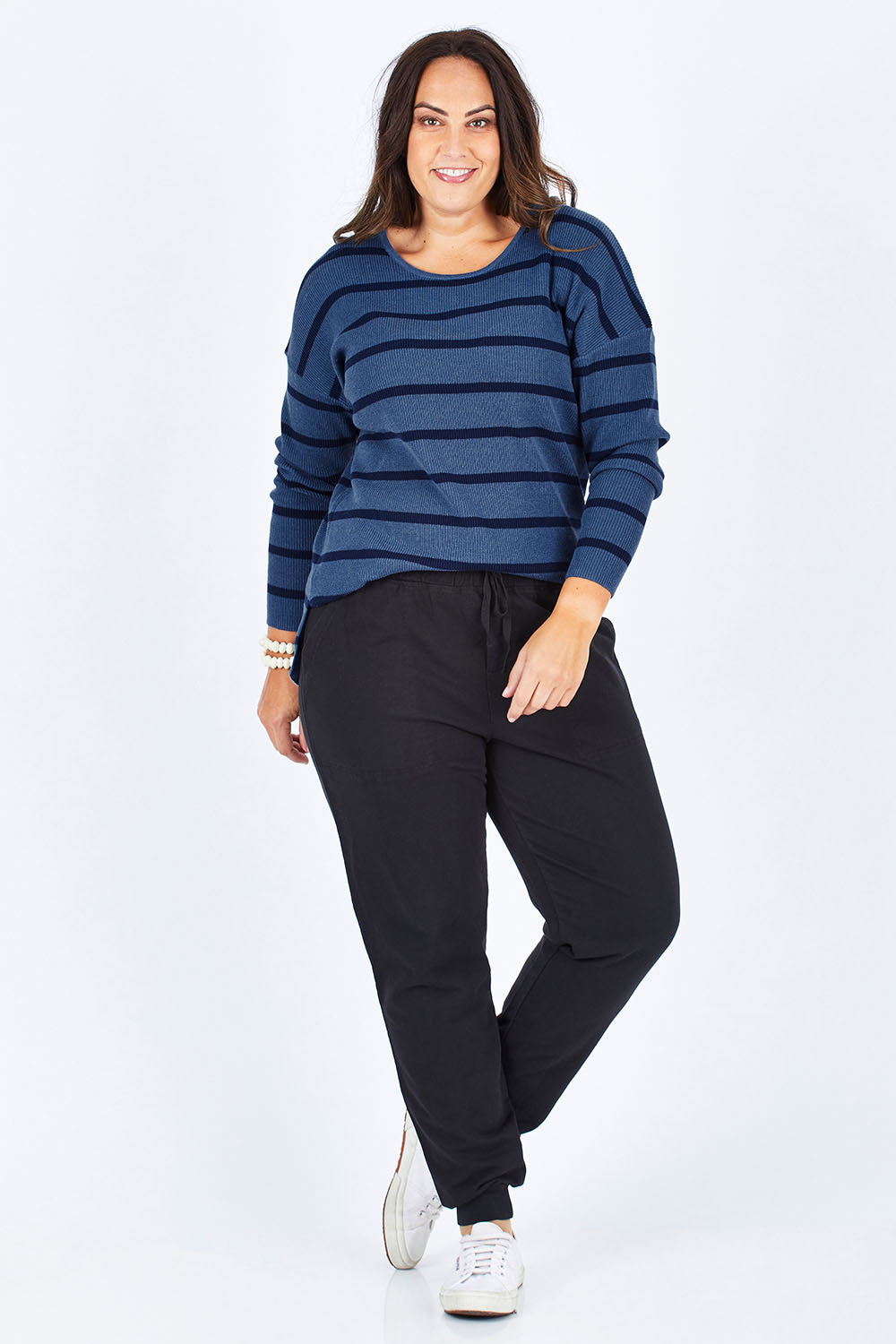 Model Stacey wearing size M of The Cotton Blend Stripe Jumper in colour BlueStripe (Blue), from the front, showing the whole outfit