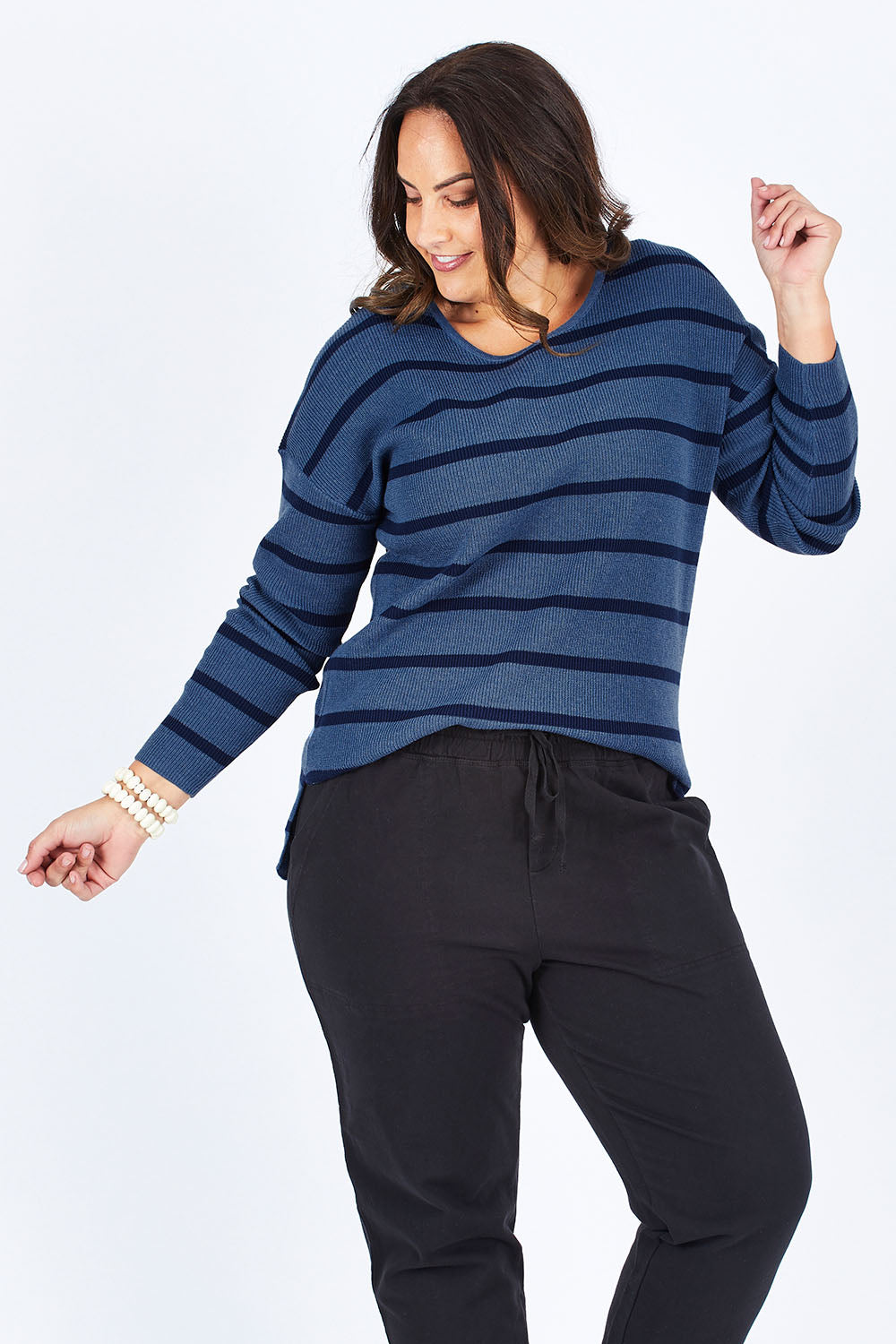 Model Stacey wearing size M of The Cotton Blend Stripe Jumper in colour BlueStripe (Blue), from the front, showing the whole outfit