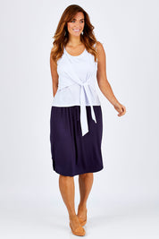 Model Laura wearing size 12 of The Tie Front Tank in colour White (White), from the front, showing the whole outfit