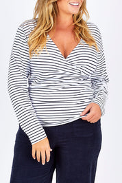 Model Fiona wearing size 16 of The Wrap Jersey Top in colour NavyStripe (Blue), from the front, cropped image