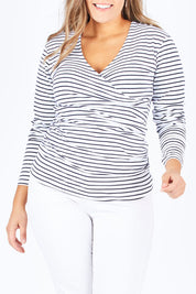 Model Natalia wearing size 14 of The Wrap Jersey Top in colour NavyStripe (Blue), from the front, cropped image