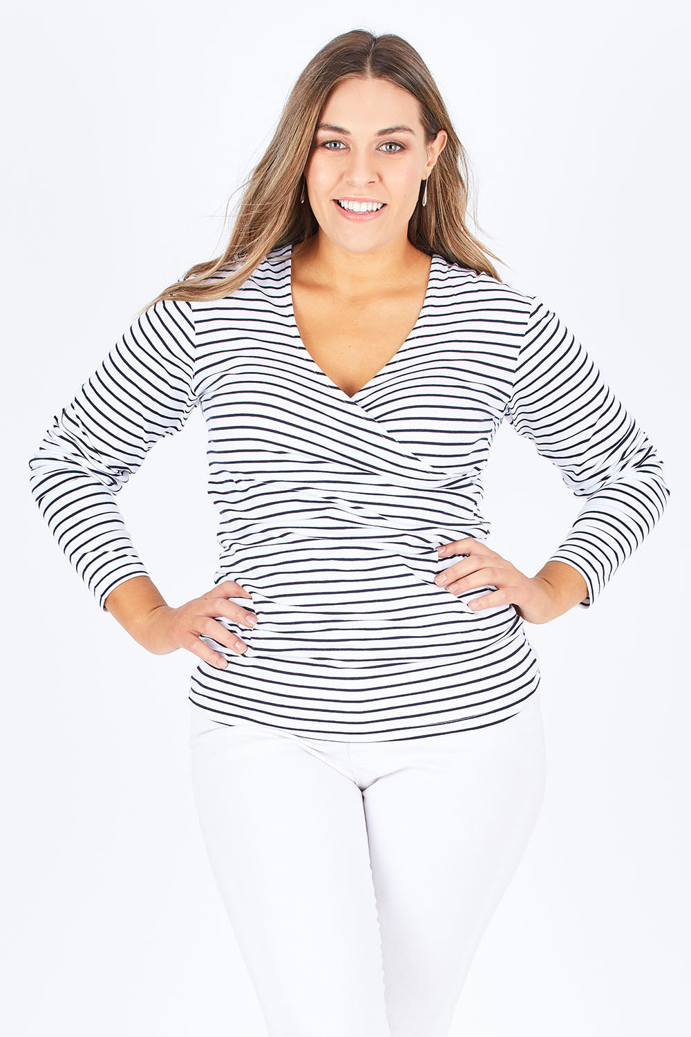 Model Natalia wearing size 14 of The Wrap Jersey Top in colour NavyStripe (Blue), from the front, cropped image